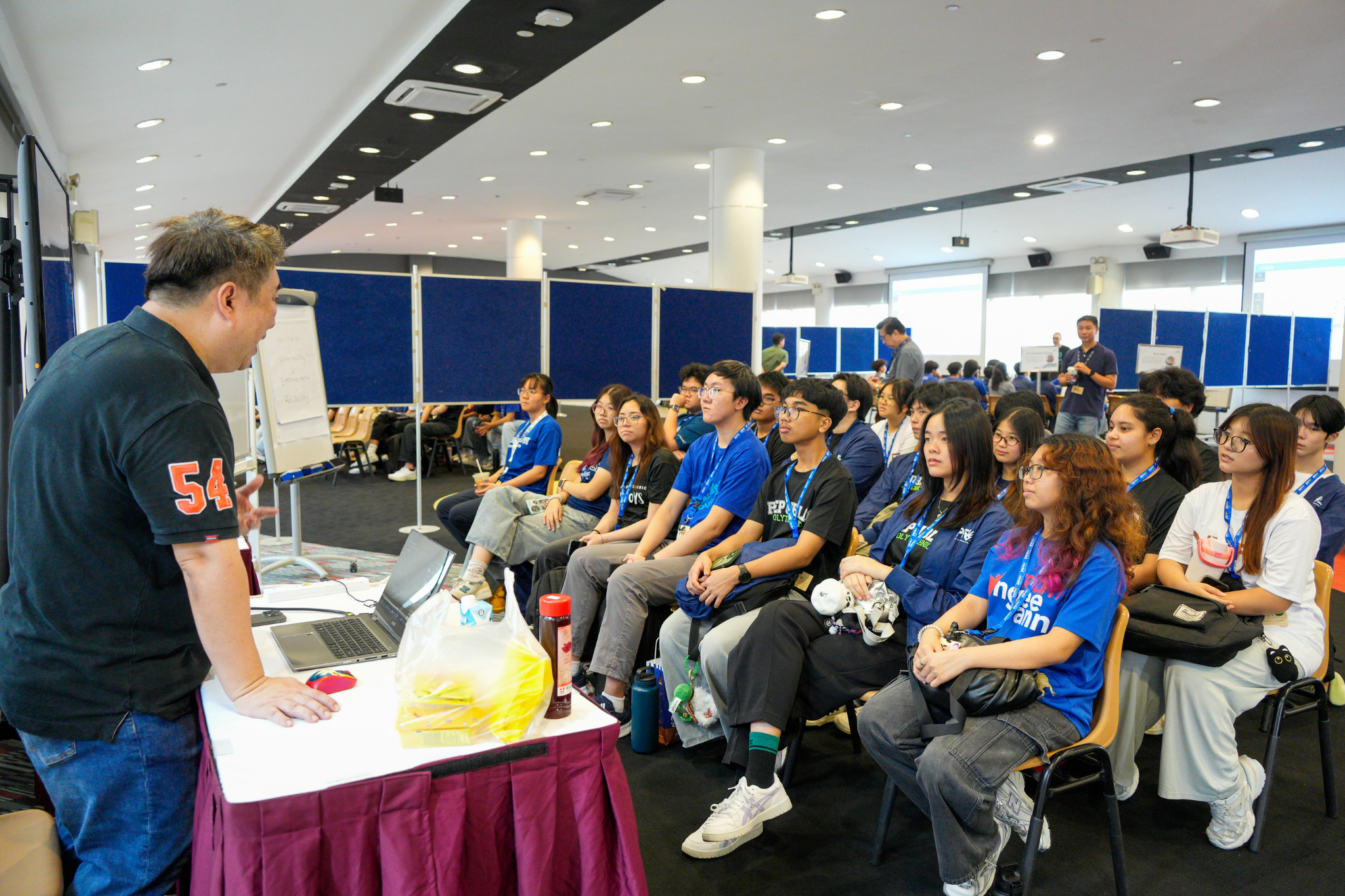 Student delegates listen to an industry speaker share insights on artificial intelligence during the Human Library session at Polytechnic Forum 2026.